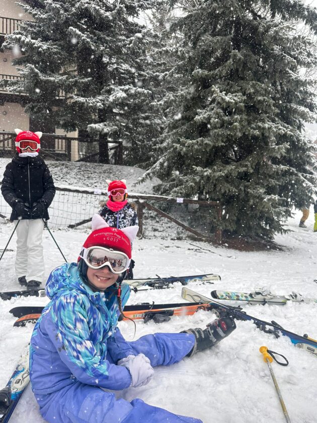 Ken Prep girls sat in the snow on Ski Tour.