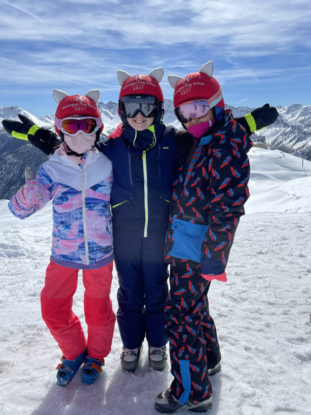Ken Prep girls smiling at the top of a snowy mountain on Ski Tour.