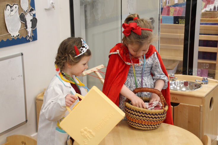 Reception girls dressed up as a doctor and little red riding hood.