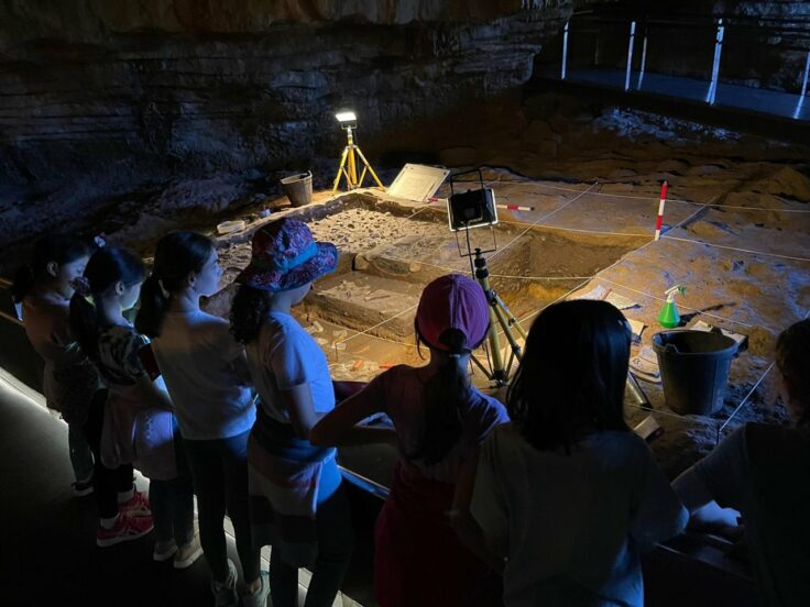 Year 6 girls exploring cave museum on Spain trip.