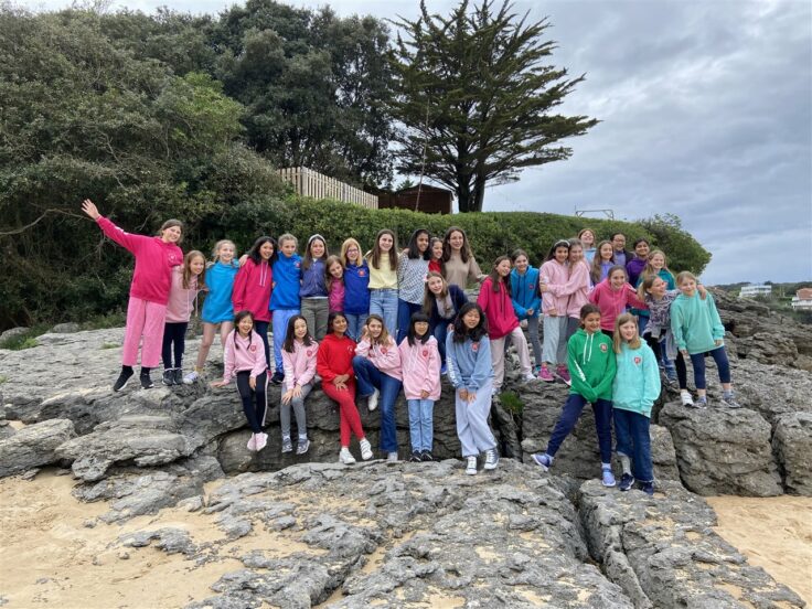 Year 6 group photo at the beach in Spain.