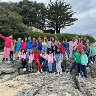 Year 6 group photo at the beach in Spain.