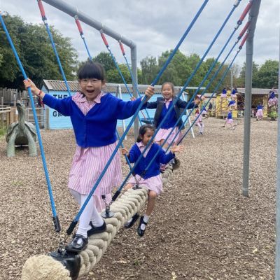 Year 2 girls playing on the playground at Battersea Zoo.