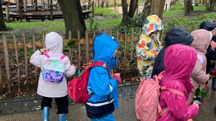 Ken Prep girls walking to Forest School in colourful coats.